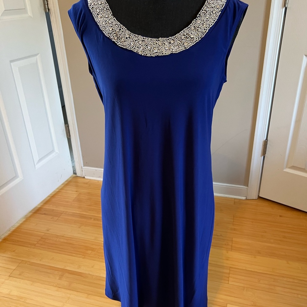 Elegant Blue Sleeveless Dress with Embellished Neckline